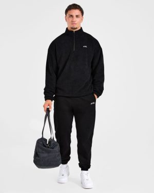 Essential 1/4 Zip Fleece - Black: The Ultimate Oversized Warmth Solution